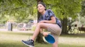 Studnets playing frisbee in the park